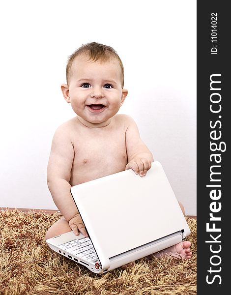 Adorable Baby With playing On Laptop. Adorable Baby With playing On Laptop