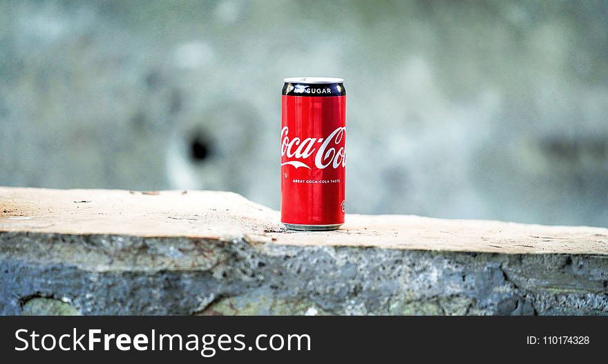 Coca-cola Can On Brown Concrete Surface