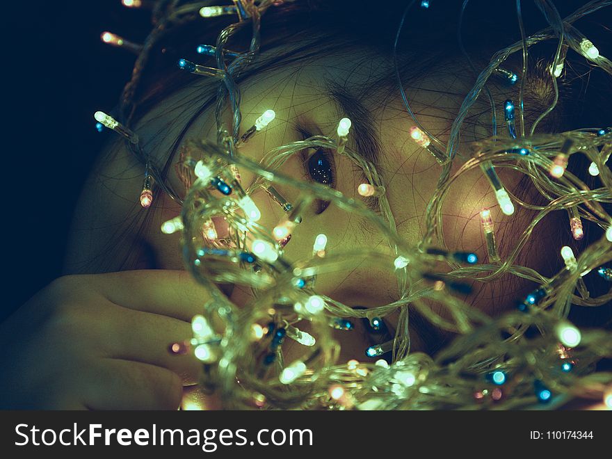 Girl Facing Turned on String Light