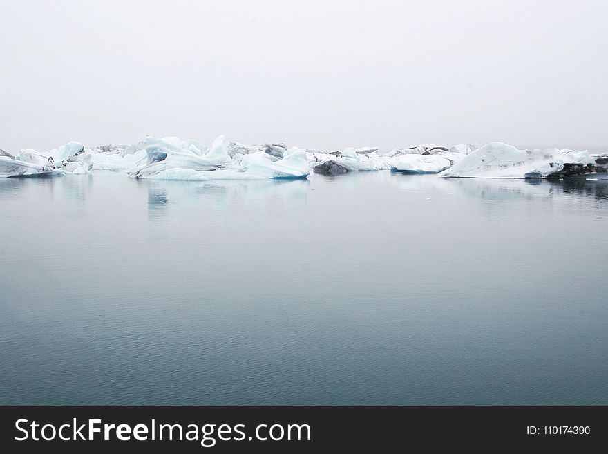 Landscape Photography of Body of Water Near Ice Berg