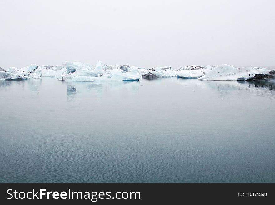 Landscape Photography Of Body Of Water Near Ice Berg