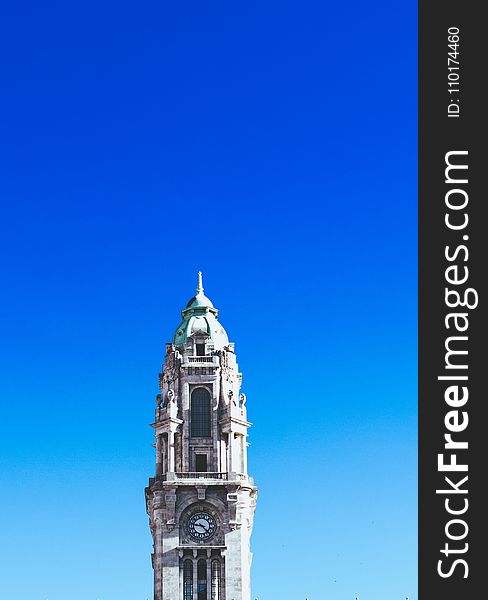 Gray Concrete Clock Tower Under Blue Sky