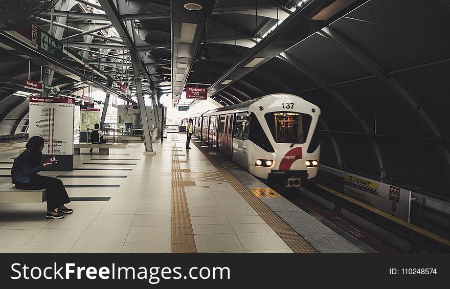 Indoor Train Station With Few People Waiting For The Train