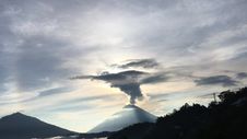 Sunrise Above Lake Batur Covered With Clouds And Mount Agung Erupting Smoke - Seen From Top Of Mount Batur In Bali, Indonesia. Stock Images Sunrise Above Lake Batur Covered With Clouds And Mount Agung Erupting Smoke - Seen From Top Of Mount Batur In Bali, Indonesia. Stock Images