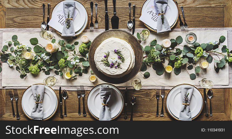 Photo of White Dinnerware Plate Set on Table