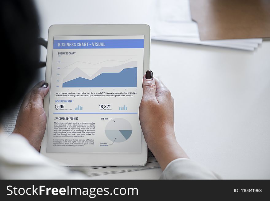 Person Holding White Ipad