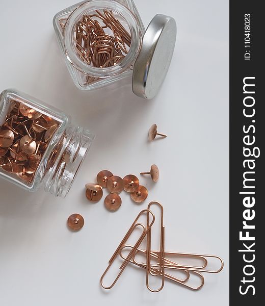 Brown Thumb Tacks And Paper Clips