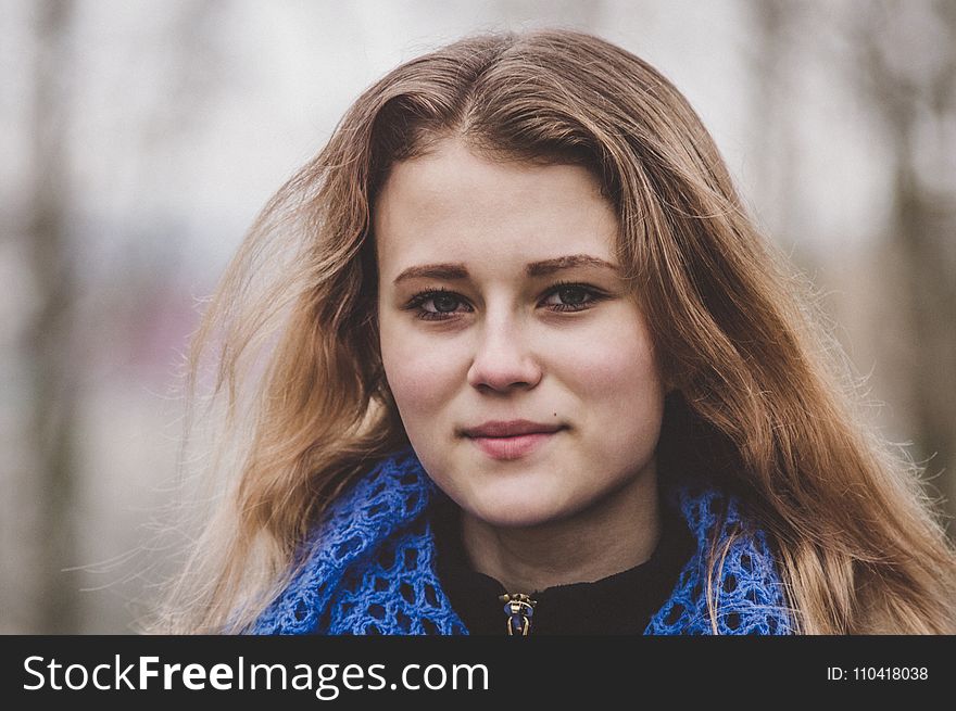 Selective Focus Photo of Woman Wearing Knitted Blue and Black Top
