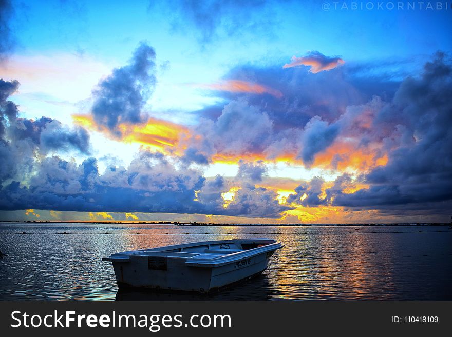 Blue, White, And Orange Skies During Sunset