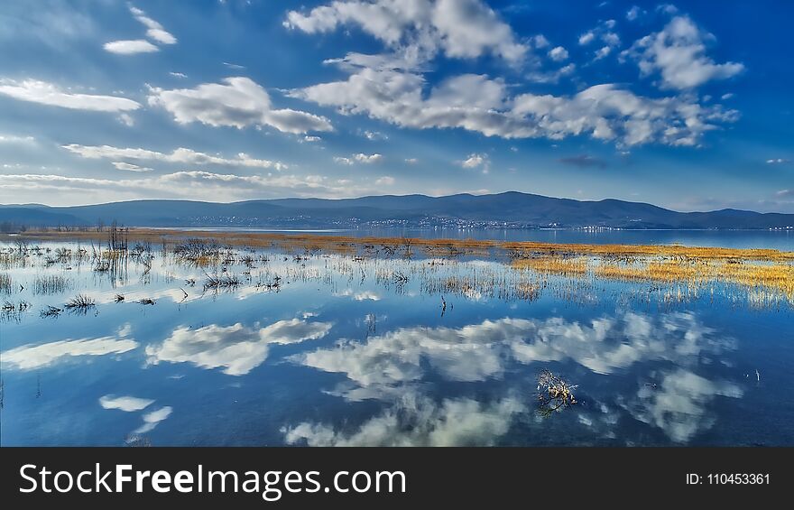 Reflection Of Clouds At The Wetland Of Lake Doriani On A Winter