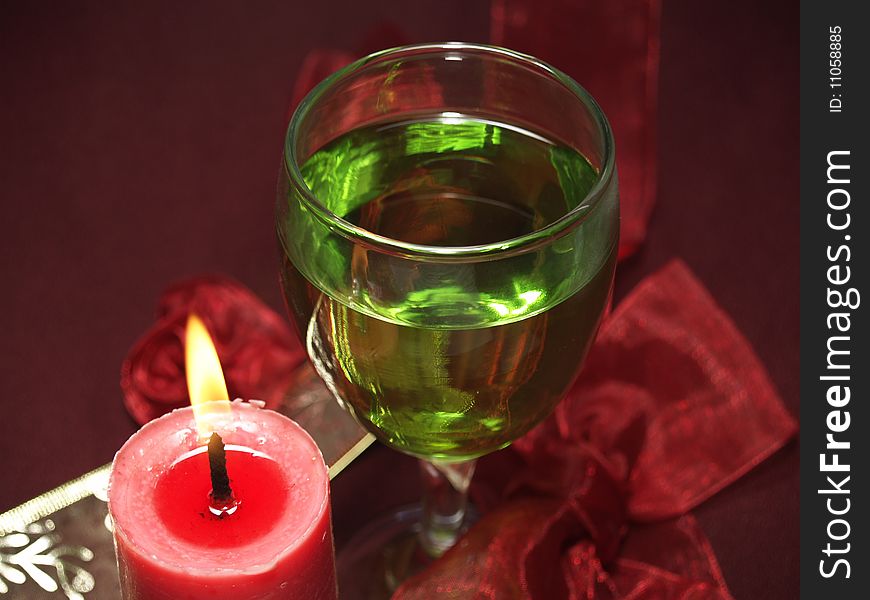 Glass and candle at the party or celebration