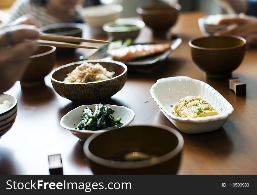 Shallow Focus Photography of Dinnerwares on Top of Brown Wooden Table