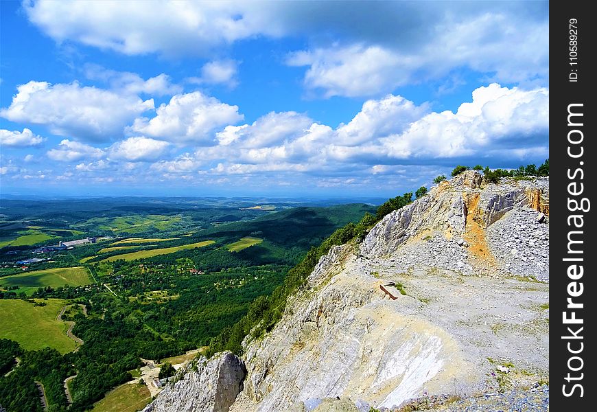 Mountain Near Green Leaf Trees Under White Cloudy Sky