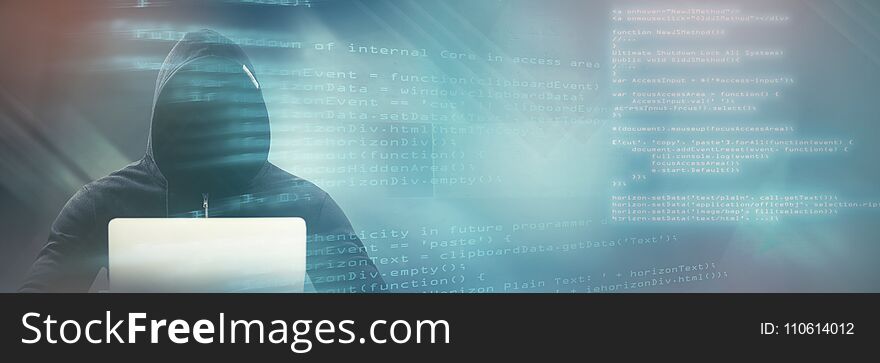 Composite image of male hacker using laptop on table