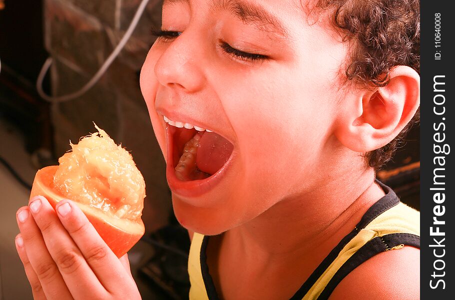 Boy enjoy with eat Fresh Mango. Boy enjoy with eat Fresh Mango