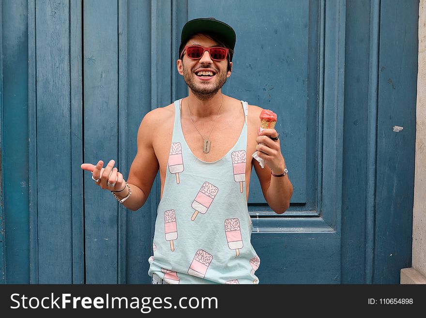 Person In Teal Ice Cream Print Tank Top Holds Ice Cream