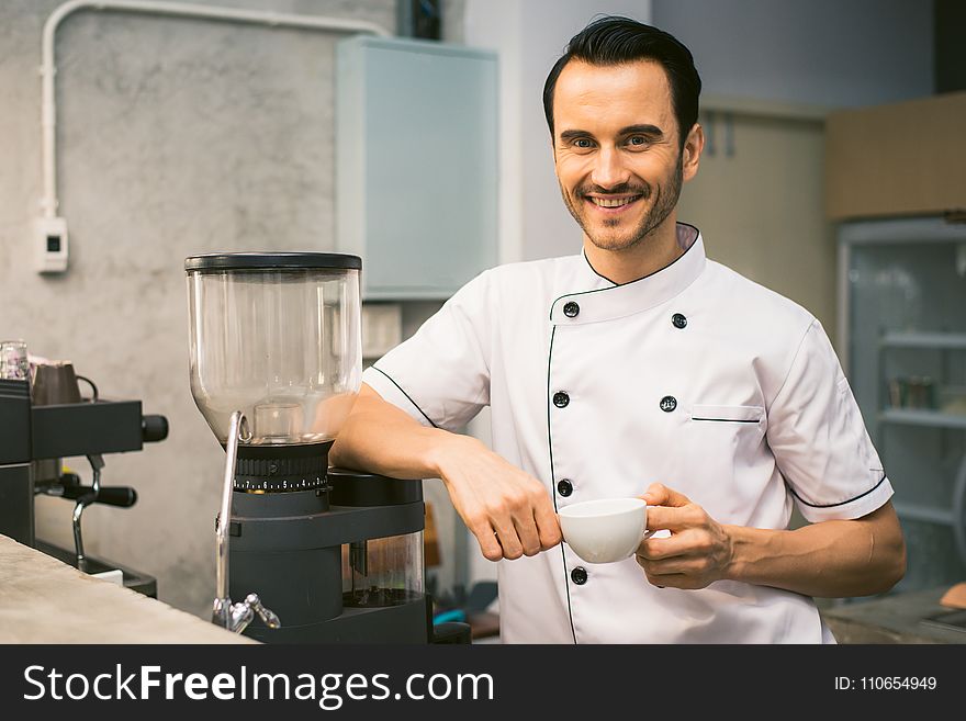 Chef Holding White Tea Cup