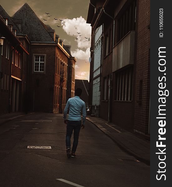 Man Walking Alone In The Street Of Town