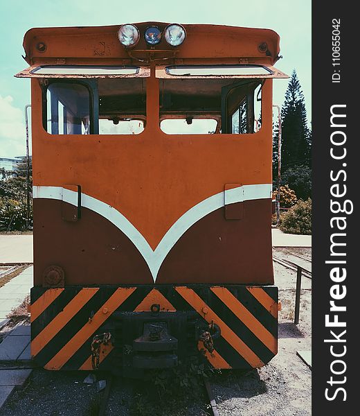 Orange, White, And Brown Train