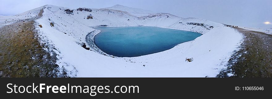 Blue Lake in the Middle of Snowfield