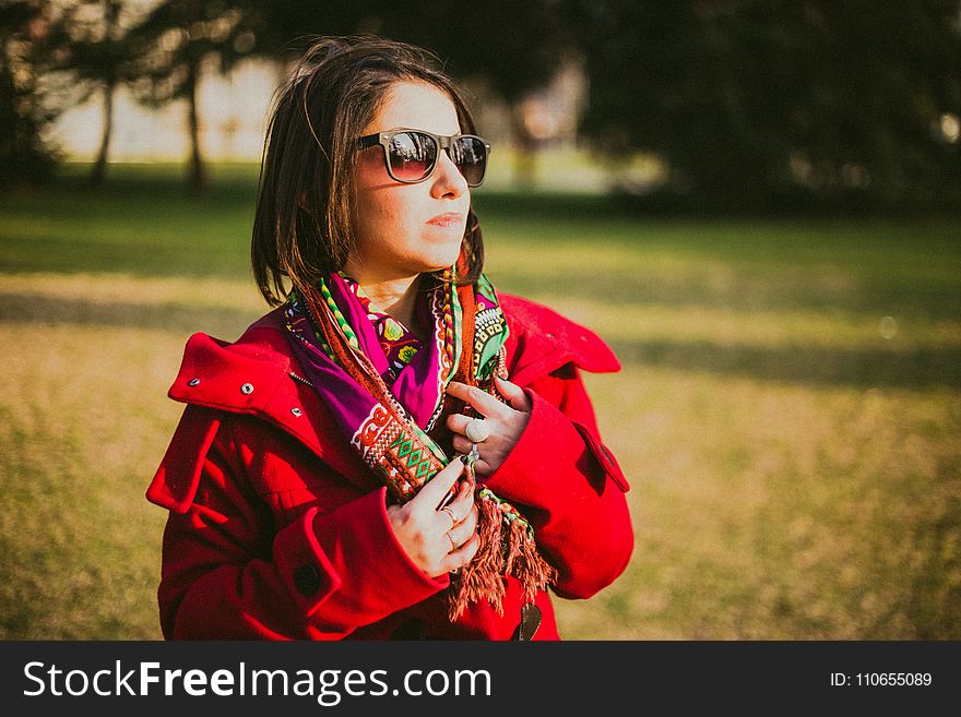 Woman In Red Coat With Black Sunglasses