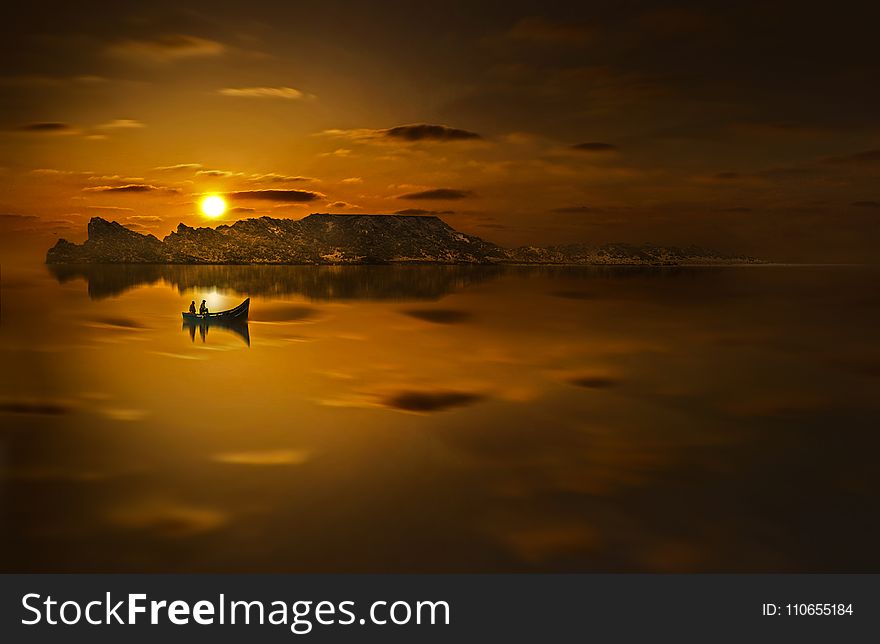 Twp People Riding Boat In Sunset Photo