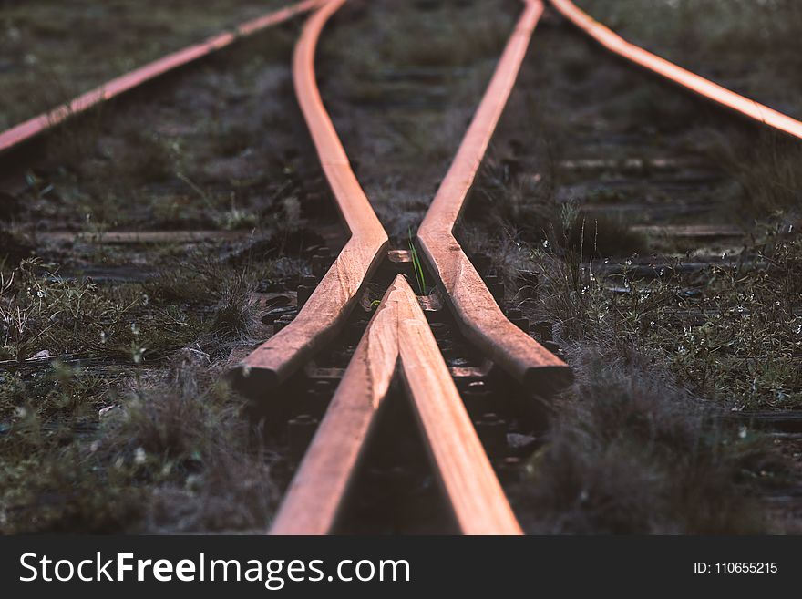 Selective-focus Photography Of Train Rail