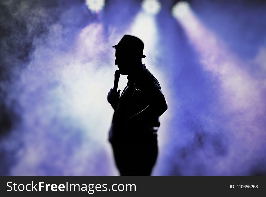 Man Holding Microphone Silhouette