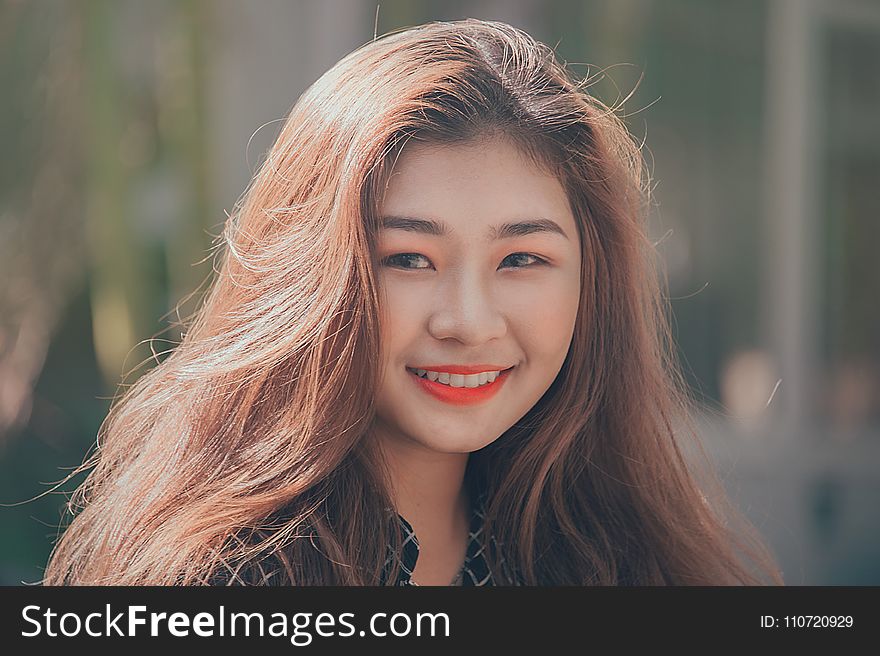 Woman Smiling Wearing Red Lipstick