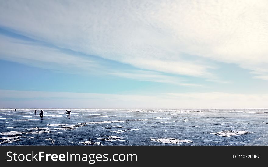 Photo of Five People on Ice Field
