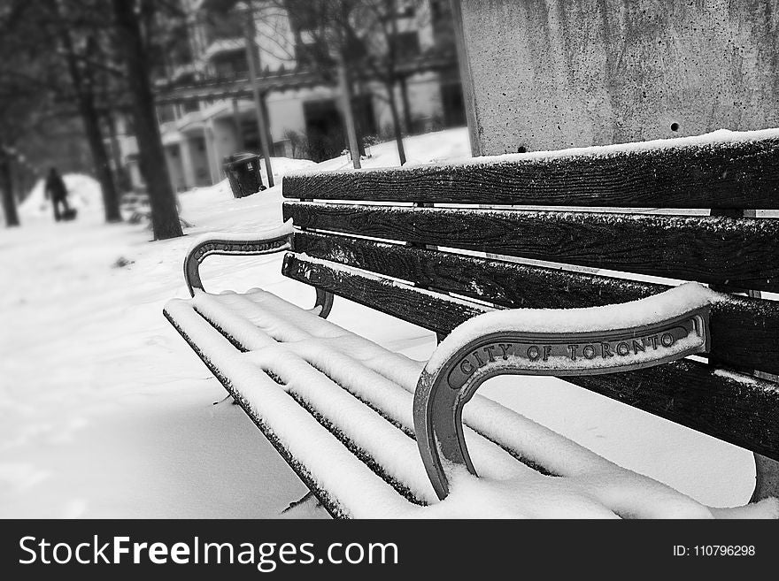 Monochrome Photography of Bench Covered with Snow