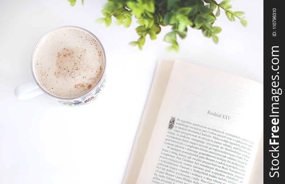 Flatlay Photography Of Book And Cup