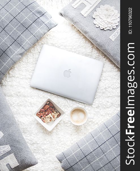 Flatlay Photography of Macbook and Snacks