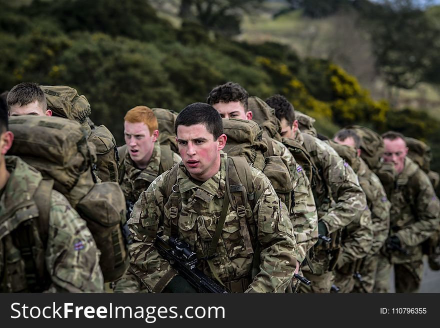 Armies in Camouflage Uniform Lining Up Closeup Photo