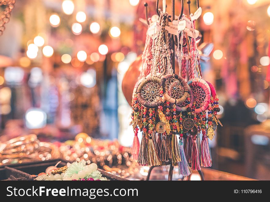 Person Showing Assorted Dream Catcher Keychain Lot in Tilt Shift Photography