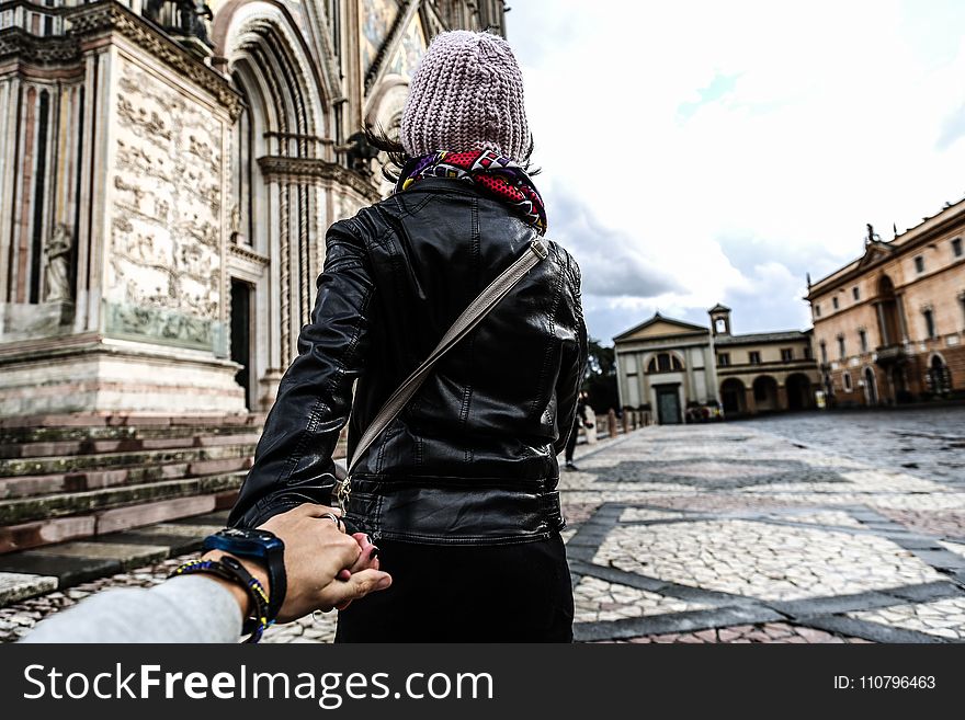 Photo of Man Holding Woman&#x27;s Hand