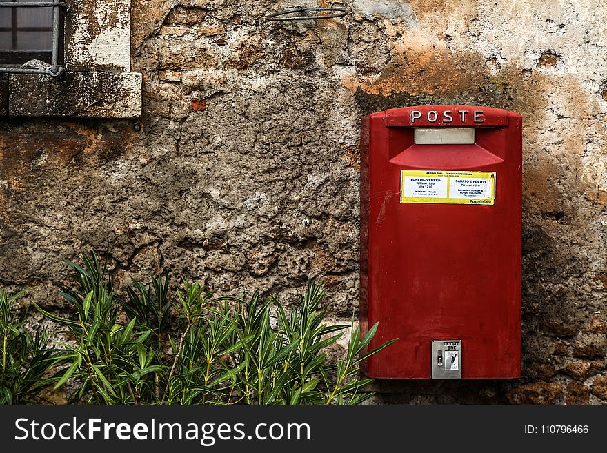 Red Mail Box Beside Green Grass