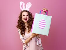 Happy Woman With Easter Shopping Bag Looking At Copy Space Stock Photos