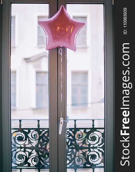 Photo of Pink Star Balloon Hang Beside Door