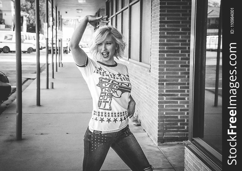 Grayscale Photo of Woman Wearing White T-shirt