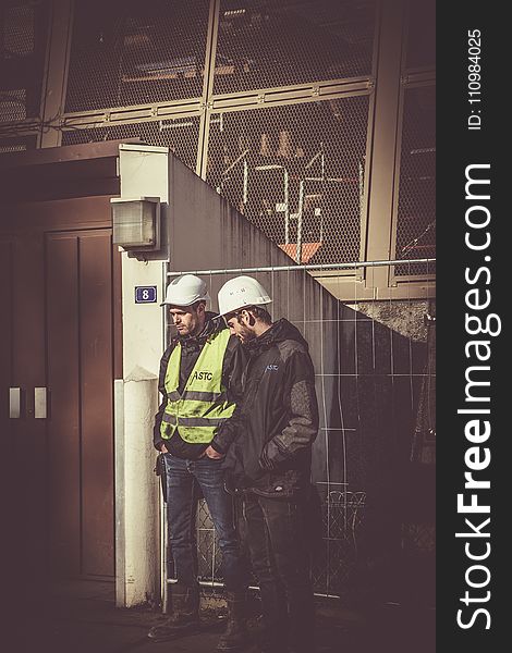 Two Men Wearing White Hard Hat