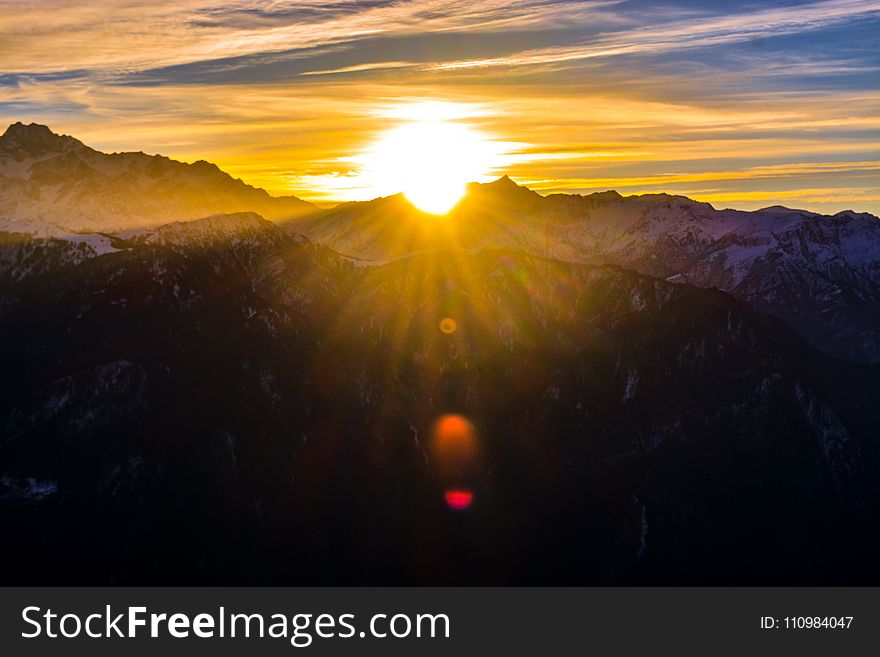 Silhouette Of Mountains During Sunrise