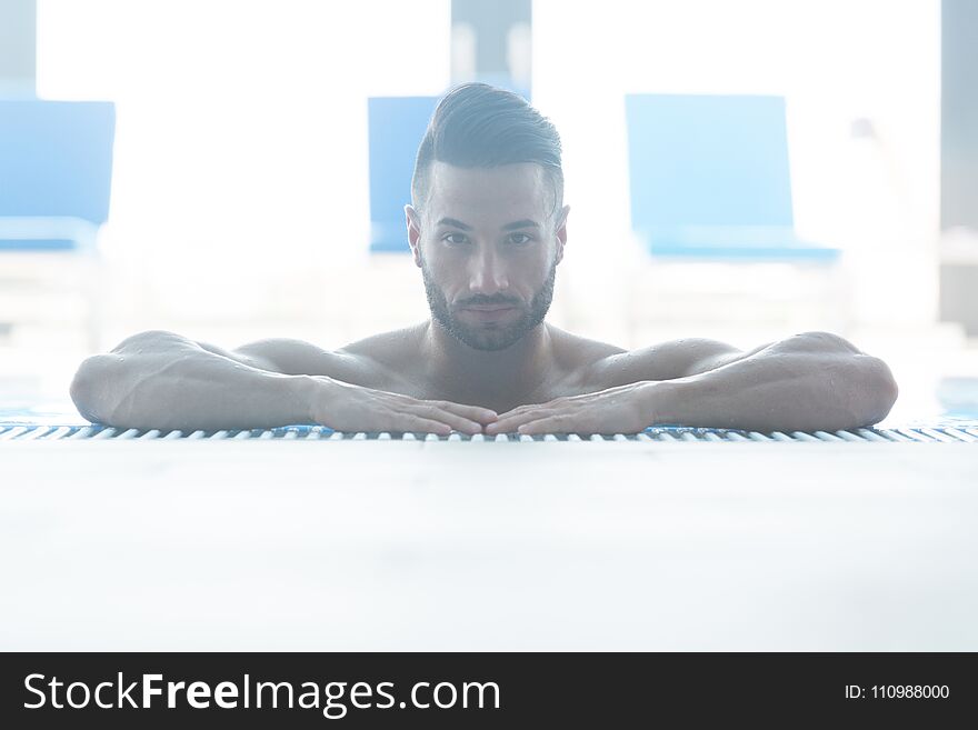 Male Swimmer Resting In Pool