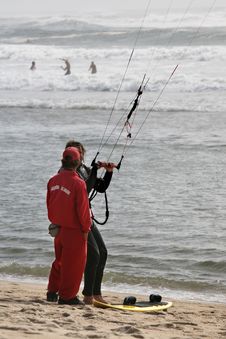 Lifeguard And Kitesurfer Stock Photography