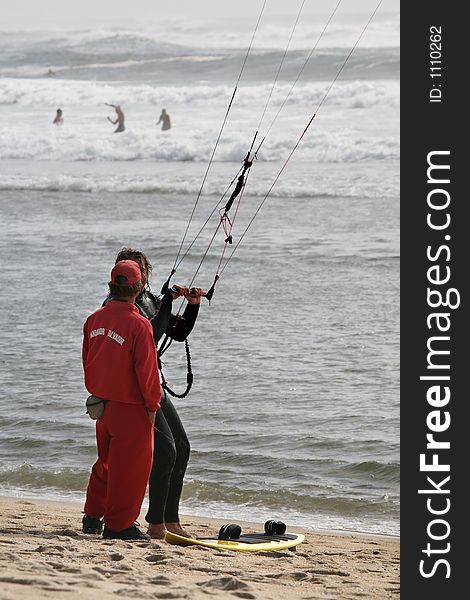 Lifeguard and kitesurfer talking portrait