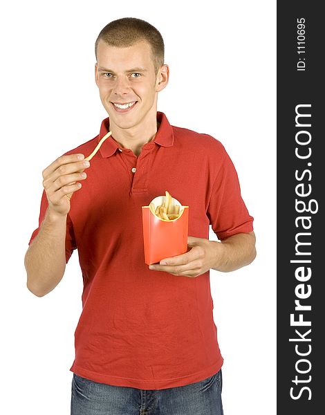 Isolated man eats French fries