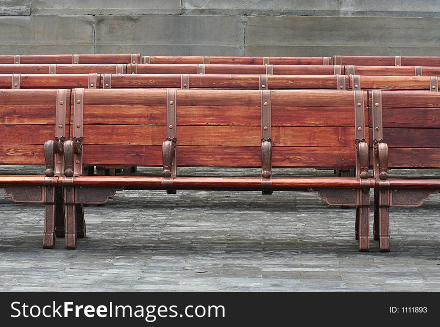 Stylish wooden empty benches alignment