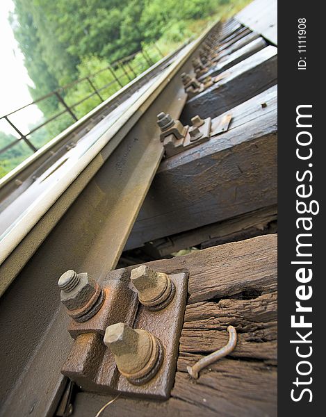 Old train track - screw close up. Old train track - screw close up.