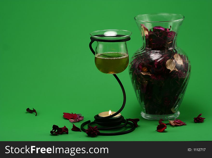 Liquid potpourri and a vase of dried flower. Liquid potpourri and a vase of dried flower