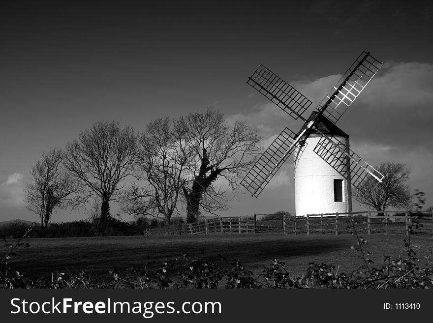 Black and white view of an old windmill. Black and white view of an old windmill